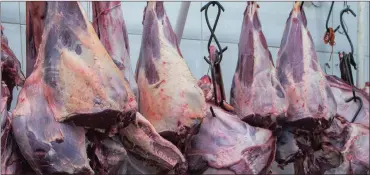  ?? PHOTO: BLOOMBERG ?? Meat hangs on display for sale at a butchery stall inside a market in São Paulo, Brazil. South Africa has now joined several other countries in suspending Brazilian meat imports.