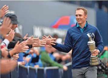  ?? STEVE FLYNN, USA TODAY SPORTS ?? With the British Open win, Jordan Spieth, above, is the second-youngest player to win the first three legs of a career Grand Slam, behind only Jack Nicklaus.