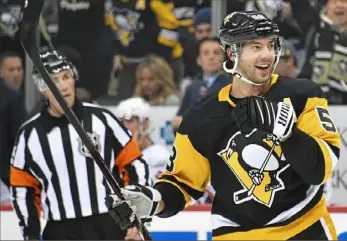  ??  ?? Kris Letang celebrates the second of his two goals in the first period.