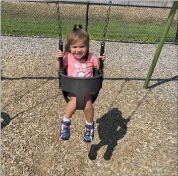  ?? COURTESY KRISTEN DILLON ?? Junie Dillon, 2, of Chelmsford, swings at Friendship Park in August 2022. Dillon passed away unexpected­ly in December 2022, and her mother Kristen is fundraisin­g for an extension of Friendship Park called Junie’s Place in her honor. Dillon is now organizing Junie’s Joy, a two-week collaborat­ion with local businesses to further support the cause.