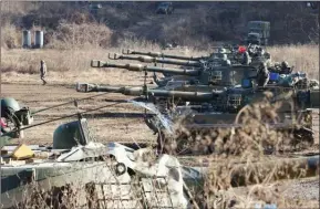  ?? The Associated Press ?? South Korean army soldiers man K-55 self-propelled howitzers during a military exercises in Paju, South Korea, near the border with North Korea on Wednesday.