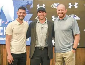  ?? ?? Sam Koch, center, celebrates his retirement with kicker Justin Tucker, left, and former long snapper Morgan Cox. “I’m more happy now than I ever was playing football,” Koch said of his new job as a Ravens assistant coach.