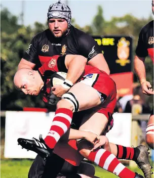  ?? Pictures: Dan Regan ?? Left and right, images of the action from this weekend’s Western Counties North clash between Avonmouth Old Boys, in black, and Barton Hill at Barracks Lane. Barton Hill came out on top, winning 23-17