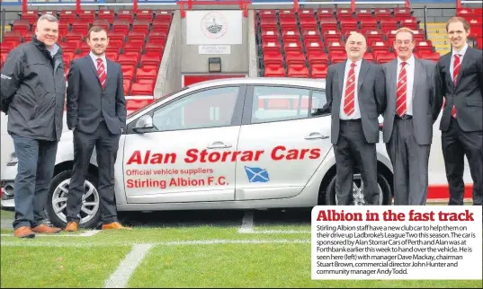  ??  ?? Stirling Albion staff have a new club car to help them on their drive up Ladbroke’s League Two this season. The car is sponsored by Alan Storrar Cars of Perth and Alan was at Forthbank earlier this week to hand over the vehicle. He is seen here (left)...