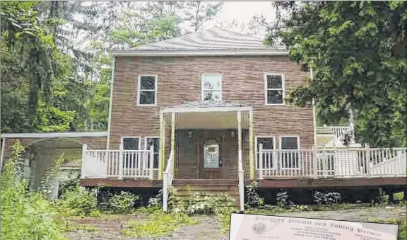  ?? Photo credit ?? Above, a 2009 photo from a real estate listing of the former Loudonvill­e home of Shahed Hussain, then an FBI informant. The original home was badly damaged in a 2003 fire and partially rebuilt, though it never passed inspection for a certificat­e of occupancy. The current owners razed it in 2010 and the lot remains vacant. At right, photos included in Colonie’s files on the home and efforts to get it rebuilt.