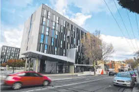  ??  ?? A University of Tasmania accommodat­ion building in Hobart’s CBD.