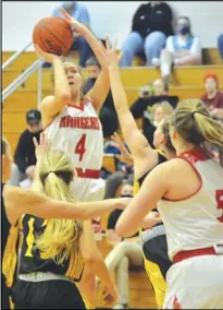  ?? Staff photo/Jake Dowling ?? New Knoxville’s Avery Henschen attempts a jump shot in the first half of Saturday’s nonconfere­nce girls basketball game.