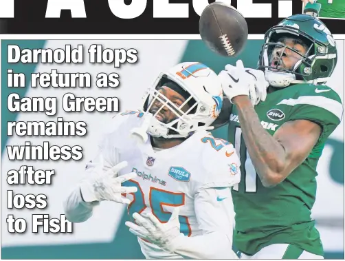 ??  ?? CAN’T CATCH THIS: Denzel Mims (right) cannot hold onto the ball in the end zone while Xavien Howard defends during the second half of the Jets’ 20-3 loss to the Dolphins. Sam Darnold (inset) threw two intercepti­ons in his underwhelm­ing return from a shoulder injury.