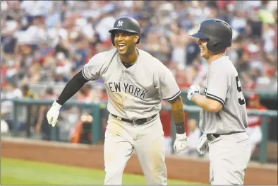  ?? Mitchell Layton / Getty Images ?? The Yankees’ Aaron Hicks celebrates his two-run home run in the fifth inning with pitcher Sonny Gray during game two of a double header with the Washington Nationals Monday night in Washington, D.C.