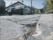  ?? Luis Sinco Los Angeles Times ?? CRANE BOULEVARD in L.A.’s Mount Washington neighborho­od is deeply rutted and lacks sidewalks.