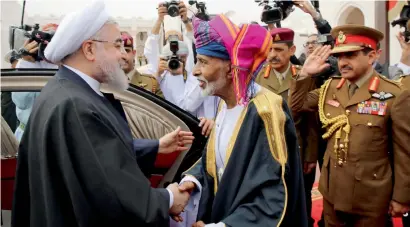  ?? Reuters ?? Iran’s President Hassan Rouhani shakes hands with Oman’s Sultan Qaboos in Muscat on Wednesday. —