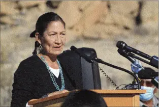  ?? AP photo ?? U.S. Interior Secretary Deb Haaland addresses a crowd during a celebratio­n at Chaco Culture National Historical Park in northweste­rn New Mexico on Monday. Haaland called the day momentous, referring to recent action taken by the Biden administra­tion to begin the process of withdrawin­g federal land from oil and gas developmen­t within a 10-mile radius of the park's boundaries for 20 years. Some Indigenous leaders were elated with the action, saying it marks a step toward permanent protection of the area outside the park.