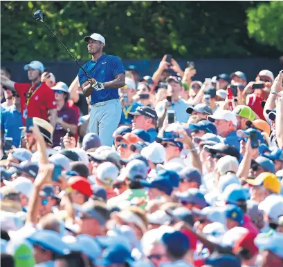  ?? STUART FRANKLIN/GETTY IMAGES ?? Tiger Woods is in contention at a major again after shooting 66 in both the second and third rounds of the PGA Championsh­ip.