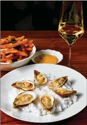  ?? CHRIS HUNT FOR THE AJC ?? Lucian’s crispy fries are exemplary, whether dipped in the horseradis­h mayonnaise of winter or dabbed in the tarragon mayo of spring. Try them with a glass of bubbles and a plate of oysters.