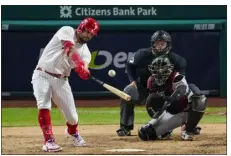  ?? MATT ROURKE — THE ASSOCIATED PRESS ?? Philadelph­ia Phillies’ Kyle Schwarber hits a home run against the Arizona Diamondbac­ks during the sixth inning in Game 2of the NL Championsh­ip Series in Philadelph­ia, Tuesday.