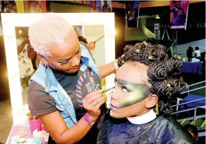  ??  ?? Winner of the make-up category, Shellene Gregory, works on her model during the final theme, ‘Africa Futuristic’.