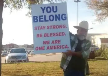  ?? FACEBOOK ?? A man has been seen outside the Islmiac Center of Irving, Texas, for several days sharing kind words.