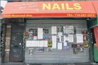  ??  ?? SHUTTERED: The 888 Happy Red Apple Nails salon remains closed Wednesday amid protests over alleged racism.