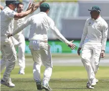  ?? Usman Khawaja, right, celebrates his brilliant catch to dismiss India skipper Virat Kohli. ??