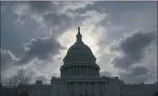  ?? J. SCOTT APPLEWHITE — THE ASSOCIATED PRESS FILE ?? In this April 12, 2019, file photo, morning clouds cover Capitol Hill in Washington, as Congress leaves for a two week recess.