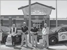  ?? Contribute­d ?? Pictured, from left, are Jane Rierson of Mannington Industries, Deputy Sheriff Jarrod Powell, Cpl. Cody Black and Senior Vice President Michael Edwards of Mannington Industries.