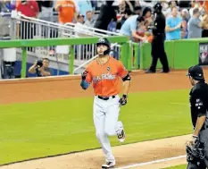  ?? MARK BROWN/GETTY IMAGES ?? Giancarlo Stanton of the Miami Marlins heads for home after hitting his 42nd homerun of the season in the third inning during the game between the Miami Marlins and the Colorado Rockies at Marlins Park on Sunday. Stanton tied the record for most...