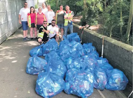  ??  ?? MCDONALD’S and Calor Gas in Caernarfon did some voluntary litter picking in the Plas by Maesincla school in Caernarfon and collected 22 bags of rubbish from the area in just a few hours.