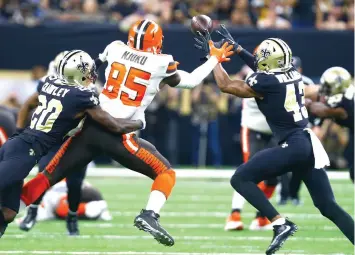  ?? Butch Dill/Associated Press ?? ■ New Orleans Saints defensive back Marcus Williams (43) intercepts a pass intended for Cleveland Browns tight end David Njoku (85) during the second half of an NFL game Sunday in New Orleans. The Saints won 21-18.