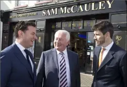  ??  ?? Ian Daly from Cardinal Capital Group, Sam McCauley and Jonathan Cosgrave, from the Carlyle Group at last week’s investment announceme­nt outside Sam McCauley’s Greystones, Co Wicklow outlet.