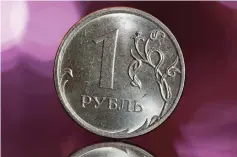  ??  ?? A Russian one rouble coin is seen in this picture illustrati­on. Russia’s CPI rose slightly above the central bank target of four per cent in 2018, the statistics service’s preliminar­y data showed. — Reuters photo