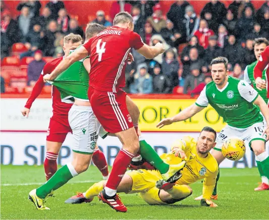  ??  ?? IN WITH A SHOUT: Aberdeen’s last home game attended by supporters was against Hibernian on March 7, with the Dons emerging as 3-1