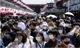  ?? Shuji Kajiyama/AP ?? People wearing face masks at Asakusa Sensoji Buddhist temple in Tokyo. Photograph: