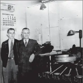  ?? Arkansas Democrat-Gazette/JOHN SYKES JR. ?? The wall calendar dates this photo to 1948, as 19-year-old bus driver Tommy DeVore (left) and supervisor Ben Hooks figure up another day’s bus fares. The machine did the counting, DeVore remembers, but Hooks insisted on finding every nickel.