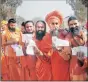  ?? PTI ?? Sadhus of Juna Akhada outside a polling booth in Haridwar, Wednesday.