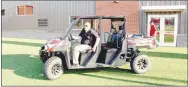  ??  ?? Farmington teacher Brian Dean shows off an all-terrain vehicle adorned in Cardinal colors during a Thursday, Aug. 15, 2019, grand opening of the ultra chic $16 million Farmington Sports Complex and Cardinal Stadium.