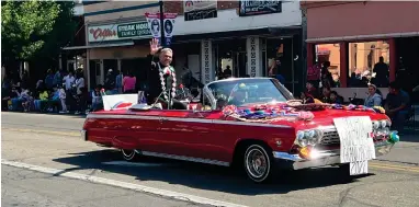  ?? RECORDER PHOTO BY ESTHER AVILA ?? A vintage vehicle drives John Gonzales, the 2022 Cinco de Mayo Grand Marshal, down the parade route Saturday at CHMA’S Cinco de Mayo Parade.