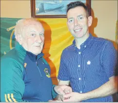  ?? (Pic: P O’Dwyer) ?? Wesley Walshe receiving his Junior B1 Hurling Championsh­ip medal from Tom Barrett, chairman of Castletown­roche GAA Club, in The Castle Arms last Friday night.