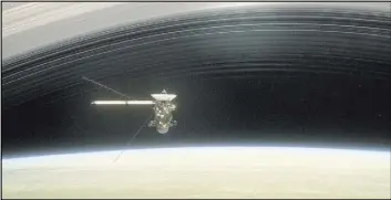  ?? The Associated Press ?? A still from the film “Cassini’s Grand Finale” shows the spacecraft diving between Saturn and the planet’s innermost ring. Launched in 1997, Cassini reached Saturn in 2004 and has been exploring it from orbit ever since.