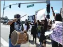  ?? BEA AHBECK/NEWS-SENTINEL ?? Carlos Reymon Gabriel plays drums as people protest Sunday in Lodi.