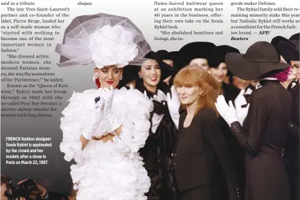  ??  ?? FRENCH fashion designer Sonia Rykiel is applauded by the crowd and her models after a show in Paris on March 22, 1987.