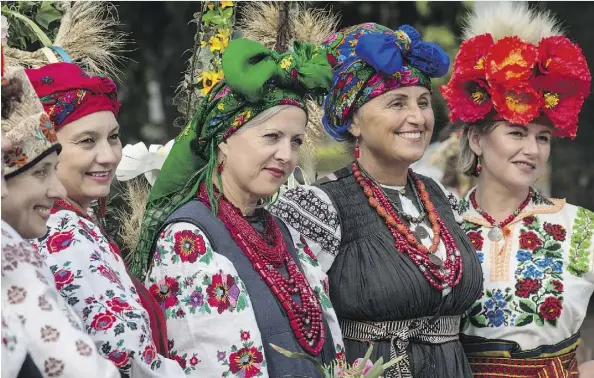  ?? SHAUGHN BUTTS ?? Thousands of people gathered in Churchill Square Sunday to celebrate Sviato 25, marking the 25th anniversar­y of Ukraine’s declaratio­n of independen­ce. Performers in traditiona­l costumes were all smiles posing for photograph­ers awaiting their turn to take the stage.