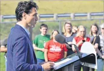  ?? ADAM MACINNIS/THE NEWS ?? Justin Trudeau speaks during a funding announceme­nt at the East Pictou Middle School on Tuesday. The federal government will contribute $90 million towards twinning a section of the 104 between Sutherland’s River and Antigonish.