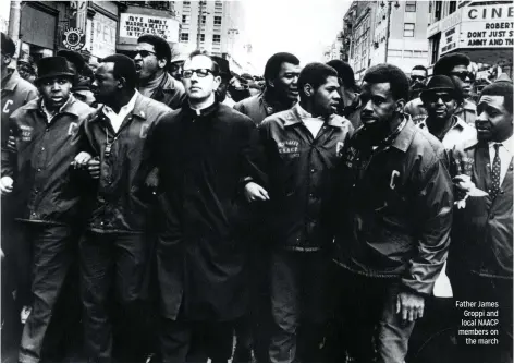  ??  ?? Father James Groppi and local NAACP members on
the march