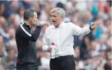  ?? Reuters ?? Manchester United manager Jose Mourinho speaks with match official Kevin Friend. —