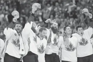  ?? KEVIN SOUSA, USA TODAY SPORTS ?? Team Canada players wave during the playing of the national anthem after defeating Team Europe in game two of the World Cup of Hockey final at Air Canada Centre. The country has been winning since 2010.