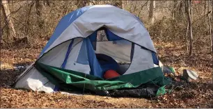  ?? Photo by Michael Derr ?? In a wooded area on Kingstown Road in Wakefield, a series of tents provide shelter to homeless residents in South Kingstown who say they choose to live there.