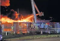  ??  ?? Cheshire Fire Service’s aerial appliance in action