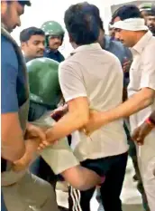  ?? — DC ?? Police officials detain Congress working president Revanth Reddy from his home on Tuesday.