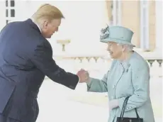  ??  ?? 0 Donald Trump grabs the Queen’s hand