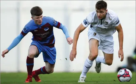  ??  ?? Conor Kane gives chase to Waterford’s Rory Feely during Friday evening’s FAI Cup tie at United Park.